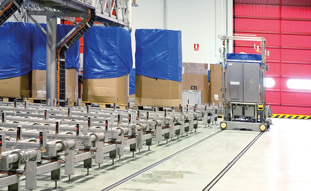 Then, a transfer car moves the pallet to the lifts, which raises them to the top floor
