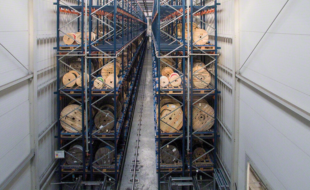 In Sector 5, there is an aisle with racks on both sides to store reels on pallets