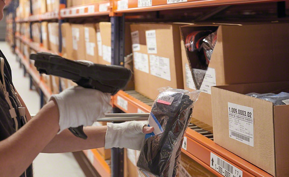 Operators collect SKUs for orders off the shelving for picking