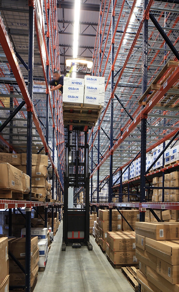 Operators work using reach trucks for handling the goods in this type of racking Operators work using reach trucks for handling the goods in this type of racking