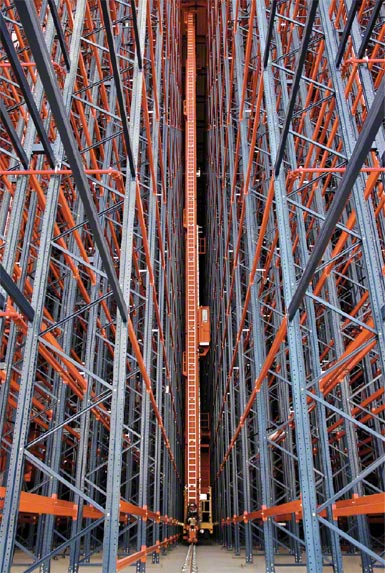 Stacker crane inside a clad-rack warehouse structure