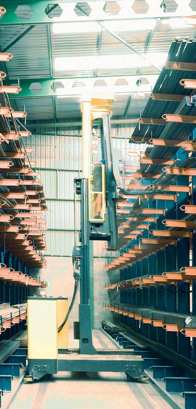 Image of a side-loading reach truck in a warehouse for metal profiles