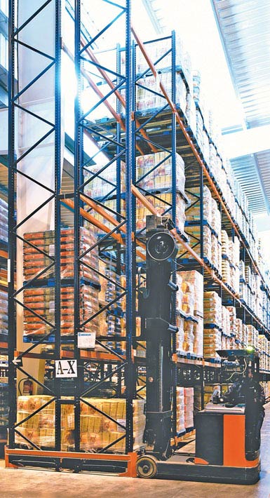 Image of a double-reach truck used in a warehouse for mass-market food products
