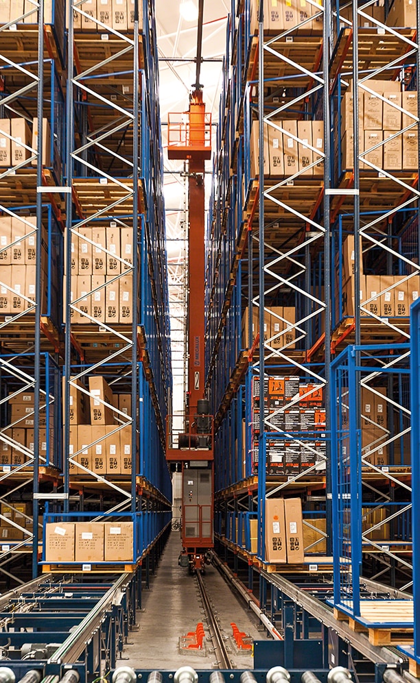 A stacker crane, placed in each of the aisles, is responsible for moving the pallets between P&D stations and the locations A stacker crane, placed in each of the aisles, is responsible for moving the pallets between P&D stations and the locations