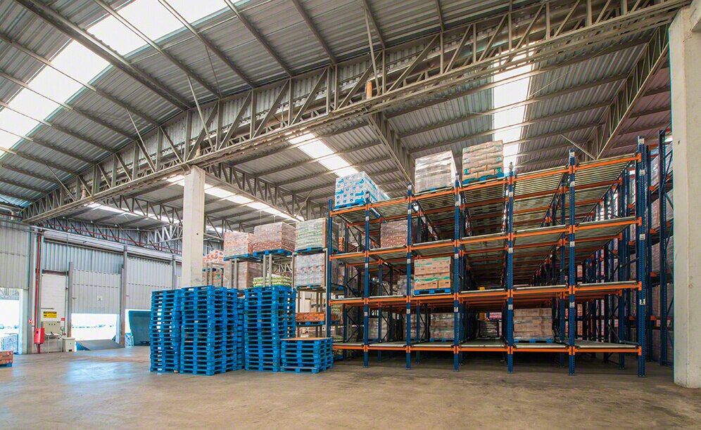 Racks are made up of roller channels on a slight incline to let pallets slide forward via gravity