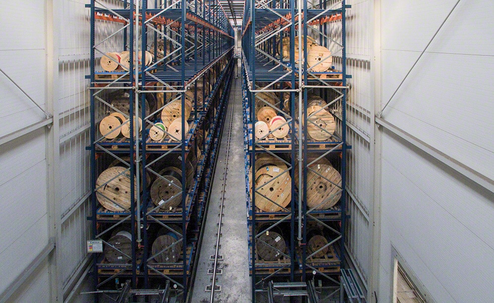 In Sector 5, there is an aisle with racks on both sides to store reels on pallets In Sector 5, there is an aisle with racks on both sides to store reels on pallets
