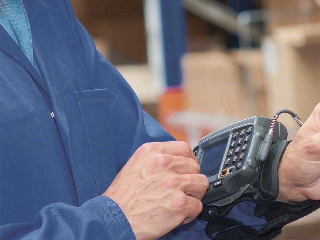 Wearable computers are attached to workers’ arms so that they can easily read the instructions from the WMS