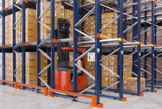 In drive-in racking, forklifts drive in the storage lanes to deposit the pallet