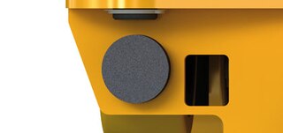 Shuttle car stops cushion the contact with the racking