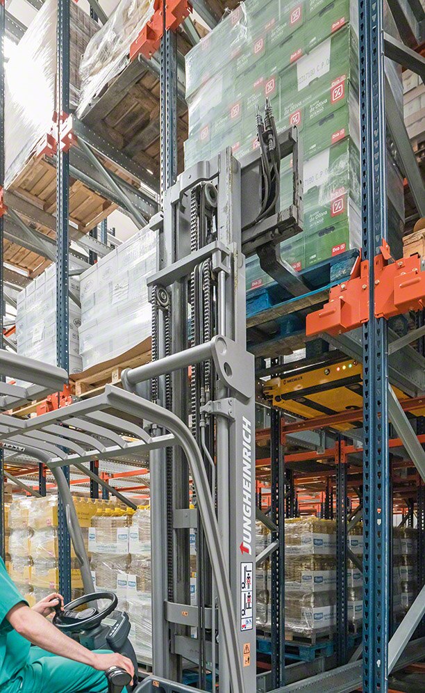 An operator handling goods on the racks An operator handling goods on the racks