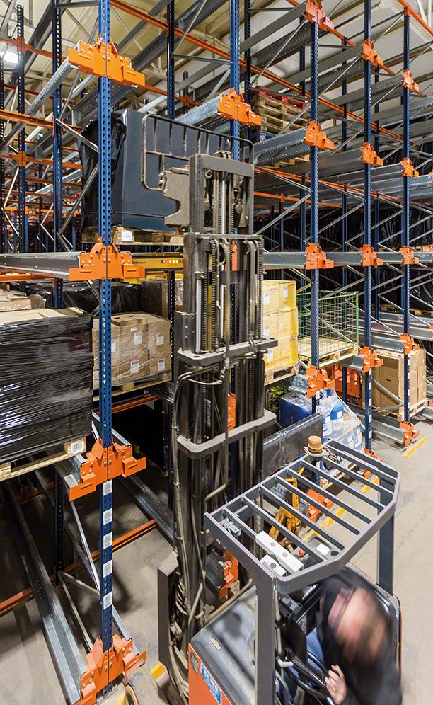 Operator inserts the automated shuttle in a storage channel Operator inserts the automated shuttle in a storage channel