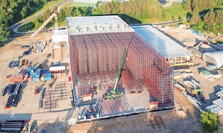 A high-bay warehouse is a logistics facility with high-bay racking