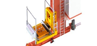 The shuttle sits in the stacker crane’s lifting cradle The shuttle sits in the stacker crane’s lifting cradle