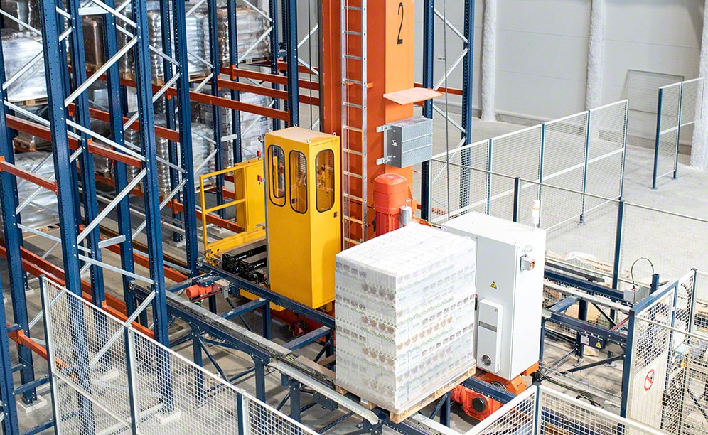 The stacker crane moves pallets to their corresponding location automatically