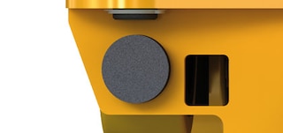 Shuttle car stops cushion the contact with the racking