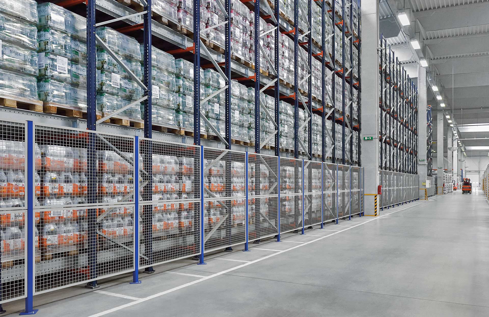 Perimeter safety enclosures are installed on the sides of the racking