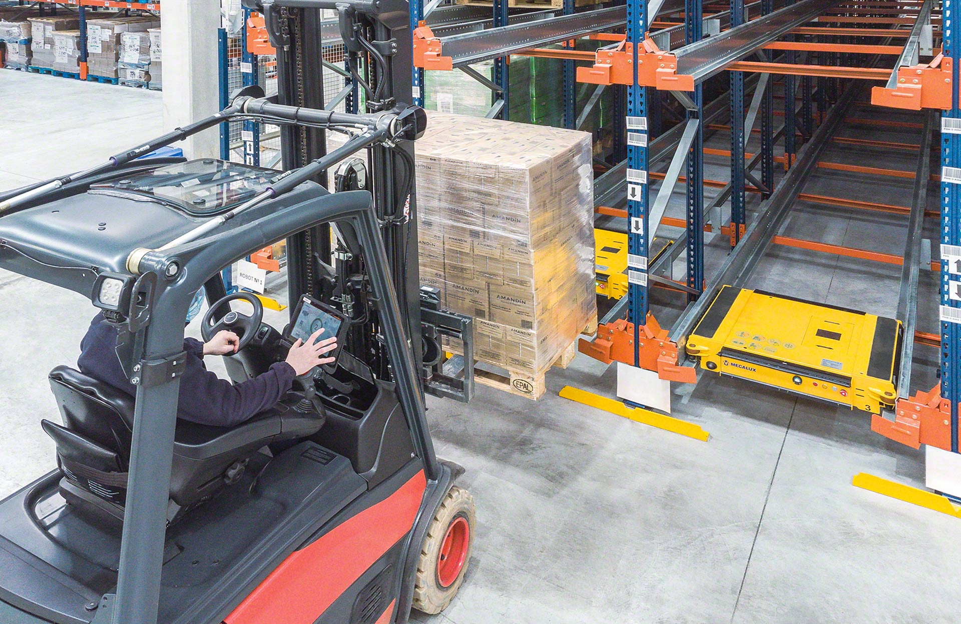 Operators use a forklift to place the pallet at the entrance to each channel