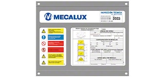 The safe load warning notice contains technical information on the push-back racking