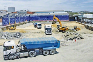 Clad rack warehouse assembly begins with the construction of the floor slab