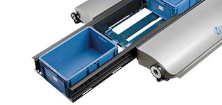 Telescopic arms transfer loads to and from the shuttle