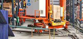 Stacker cranes can also change aisles via the curved track system