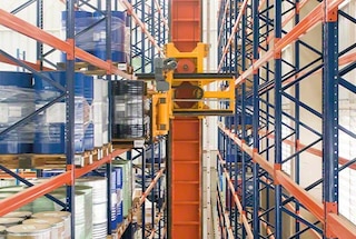 The trilateral forks enter the racking to deposit the pallet
