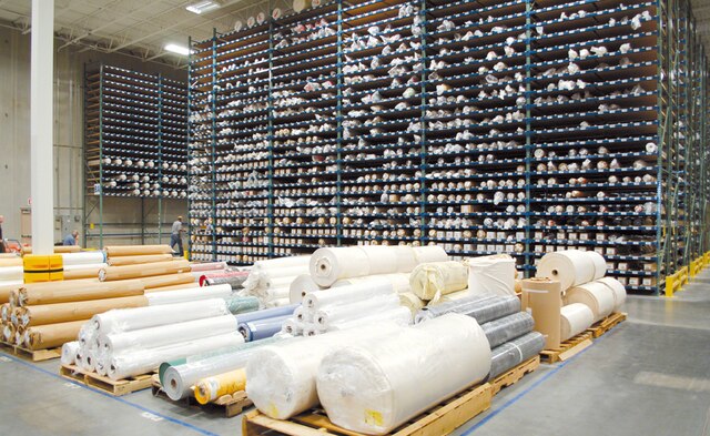 This warehouse solution enabling the storage of a great amount of fabric rolls and to locate them quickly
