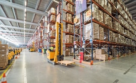 The forklift trilateral trucks placing the pallets on the Conventional Pallet Racking